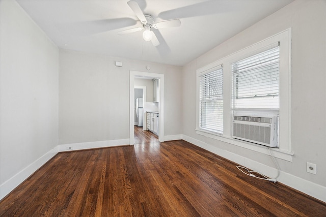 spare room with cooling unit, ceiling fan, and dark hardwood / wood-style flooring