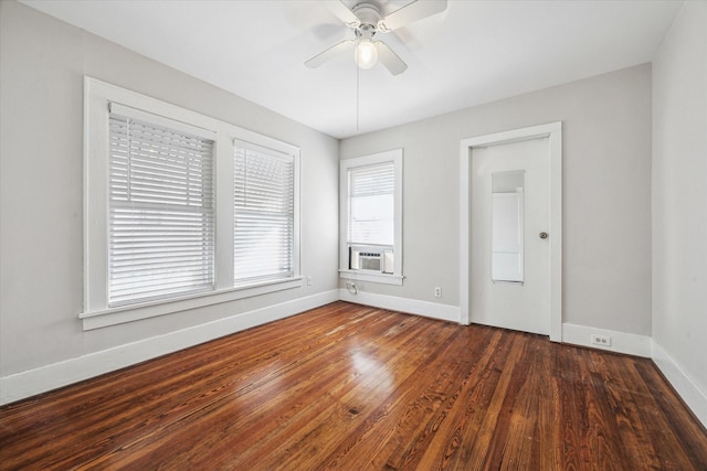 spare room featuring dark hardwood / wood-style floors and ceiling fan