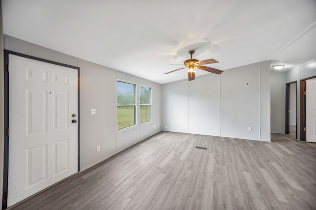 unfurnished living room with hardwood / wood-style floors, ceiling fan, and lofted ceiling