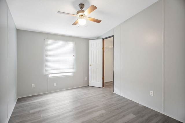 empty room featuring light hardwood / wood-style flooring and ceiling fan