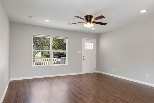 entrance foyer featuring ceiling fan and dark wood-type flooring