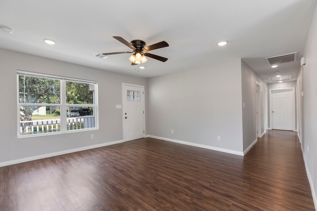 unfurnished room featuring dark hardwood / wood-style floors and ceiling fan