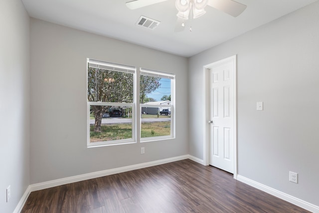 unfurnished room featuring dark hardwood / wood-style floors and ceiling fan