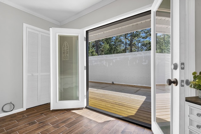 doorway featuring crown molding, dark wood-type flooring, and french doors