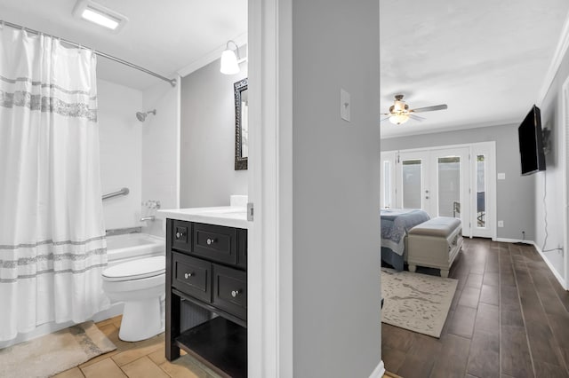 full bathroom featuring shower / bath combination with curtain, vanity, ceiling fan, hardwood / wood-style flooring, and toilet