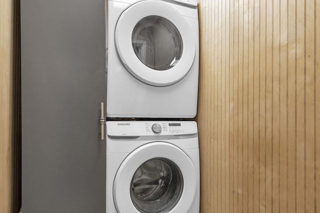 laundry room featuring stacked washer and dryer