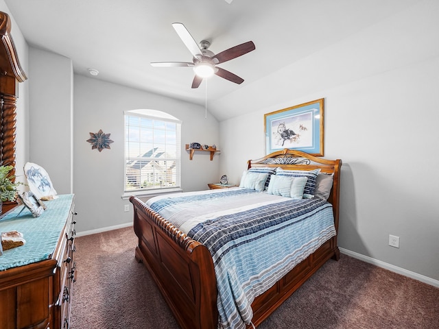 bedroom featuring vaulted ceiling, ceiling fan, and dark carpet