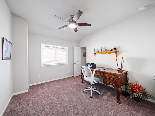 carpeted office space featuring vaulted ceiling and ceiling fan