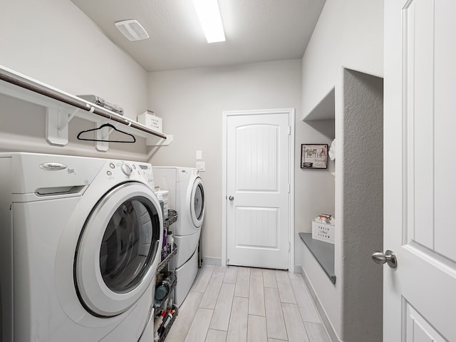 laundry area featuring separate washer and dryer