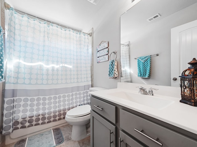 bathroom with vanity, tile patterned flooring, and toilet