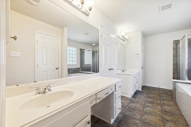 bathroom featuring vanity and independent shower and bath