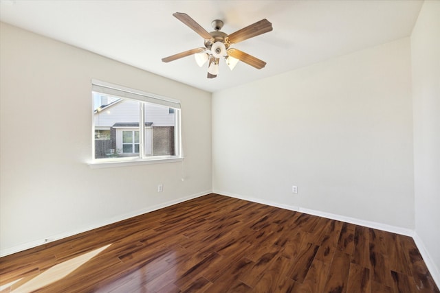 unfurnished room with ceiling fan and dark hardwood / wood-style floors