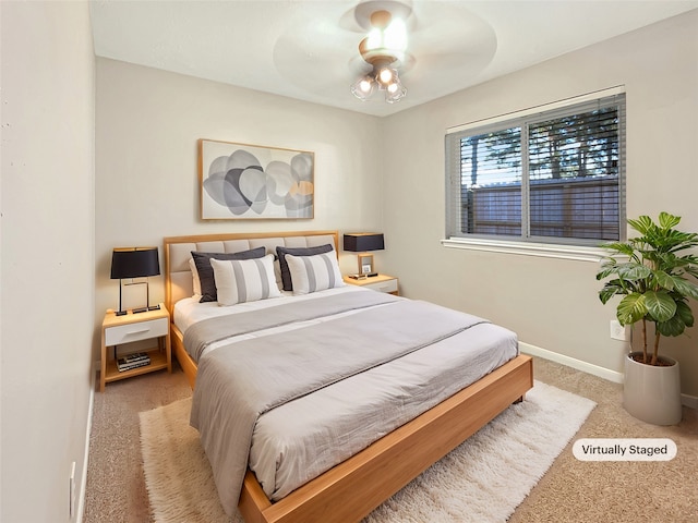 bedroom featuring ceiling fan and carpet floors