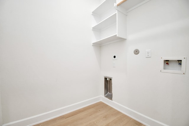 laundry room with hardwood / wood-style flooring, hookup for an electric dryer, gas dryer hookup, and hookup for a washing machine