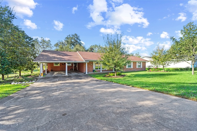 ranch-style home featuring a front yard and a carport