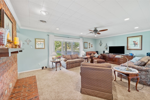 carpeted living room with a fireplace, ceiling fan, and ornamental molding