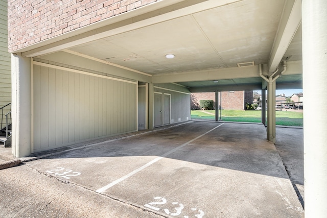 garage featuring a carport