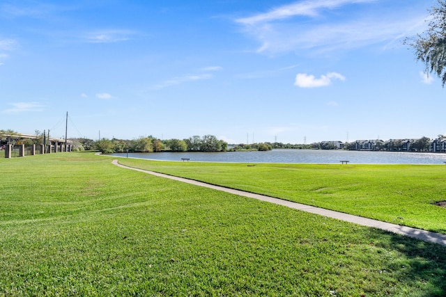 exterior space with a lawn and a water view