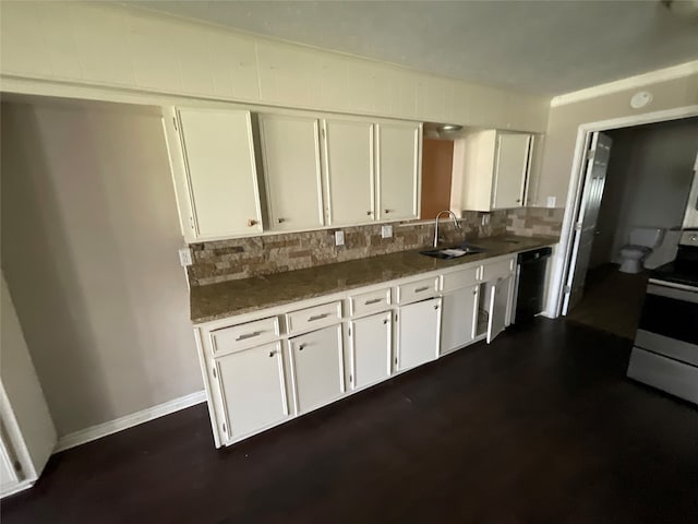 kitchen featuring dark stone counters, white range oven, sink, dishwasher, and white cabinetry