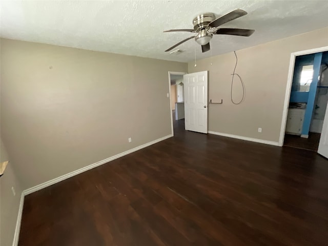 unfurnished bedroom featuring a textured ceiling, ensuite bath, ceiling fan, and dark hardwood / wood-style floors