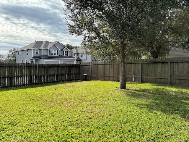 view of yard featuring a fenced backyard