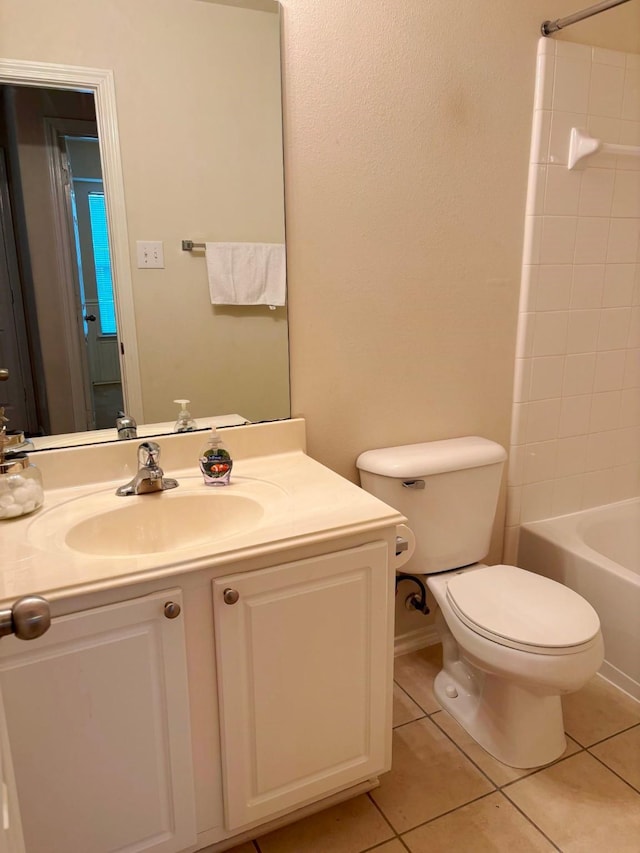 bathroom featuring toilet, bathing tub / shower combination, vanity, and tile patterned floors