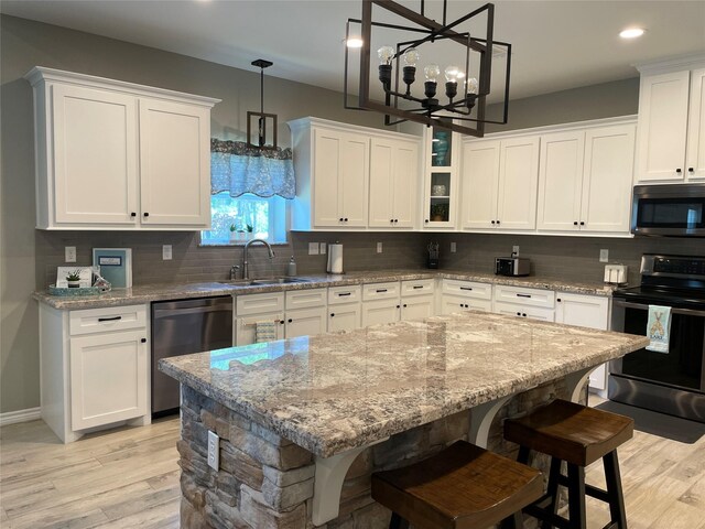 kitchen featuring white cabinets and stainless steel appliances