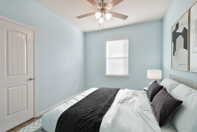 bedroom featuring hardwood / wood-style floors and ceiling fan