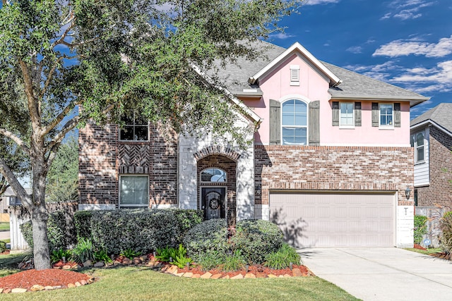 view of front of house featuring a front lawn and a garage