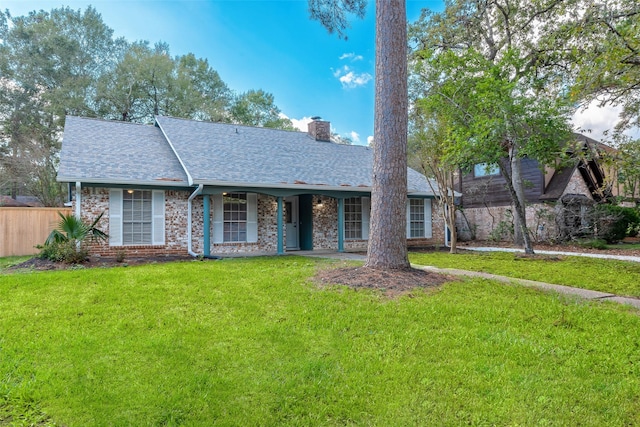 ranch-style house with a front yard