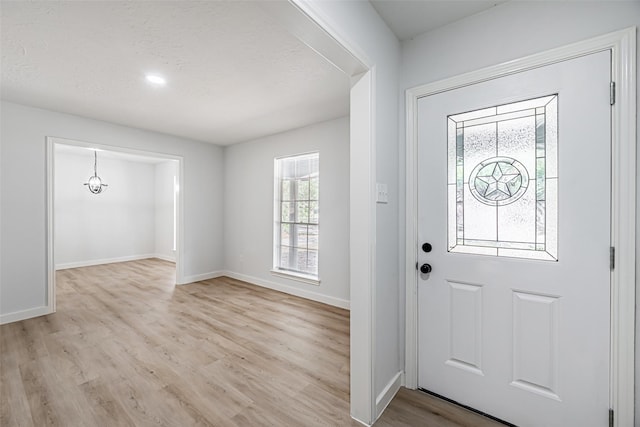 foyer with light hardwood / wood-style floors