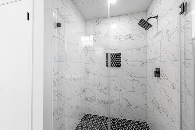 bathroom with tiled shower