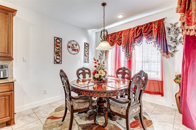 dining room featuring light tile patterned flooring