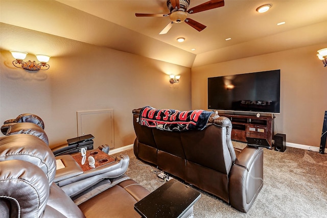 carpeted cinema with ceiling fan and vaulted ceiling