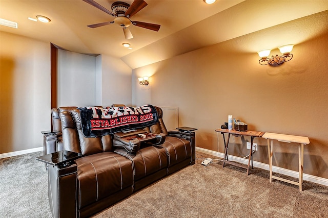 home theater featuring ceiling fan, vaulted ceiling, and carpet floors