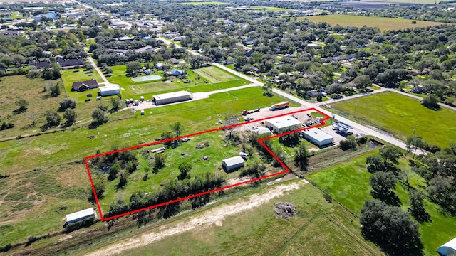 birds eye view of property featuring a rural view