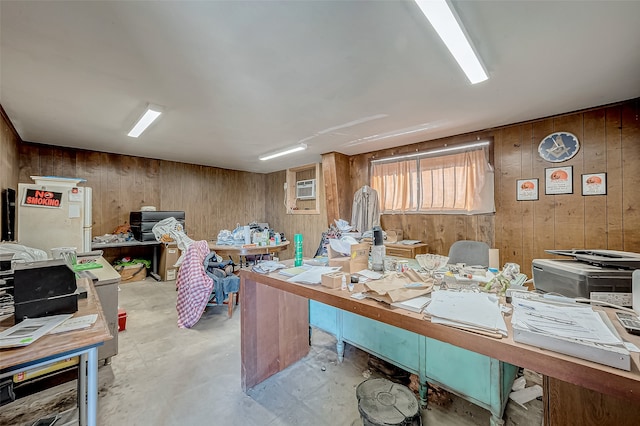 office area featuring wood walls