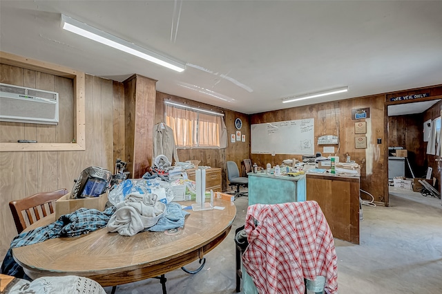 dining room with wood walls and an AC wall unit