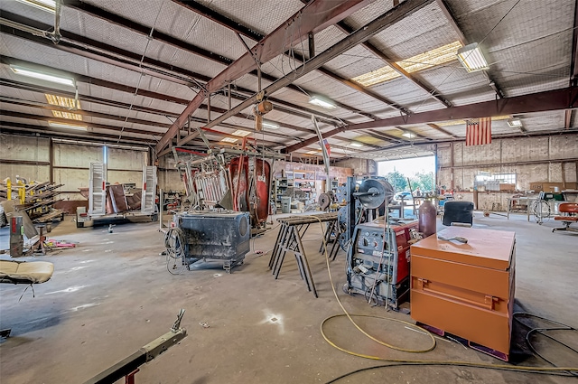 misc room featuring a workshop area and concrete floors