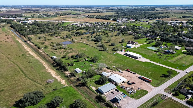 birds eye view of property with a rural view