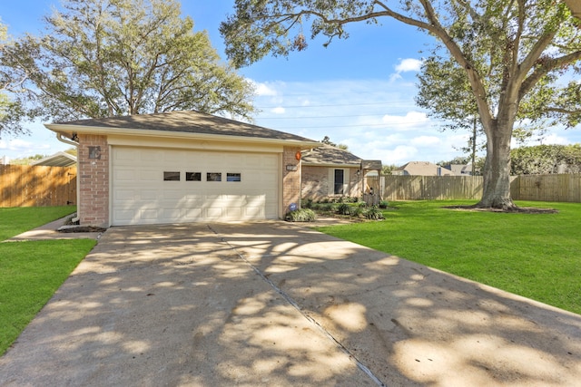 single story home with a garage and a front lawn