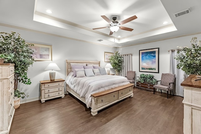 bedroom featuring a raised ceiling, ceiling fan, crown molding, and dark hardwood / wood-style floors