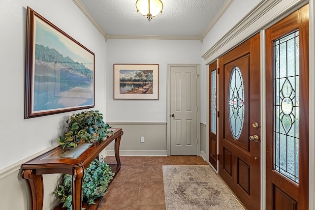 entryway featuring crown molding, light tile patterned floors, and a textured ceiling