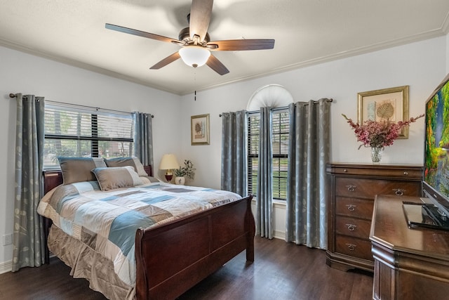 bedroom with ceiling fan, dark hardwood / wood-style flooring, and crown molding