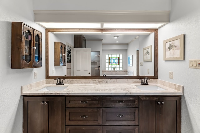 bathroom with vanity, a shower, and crown molding