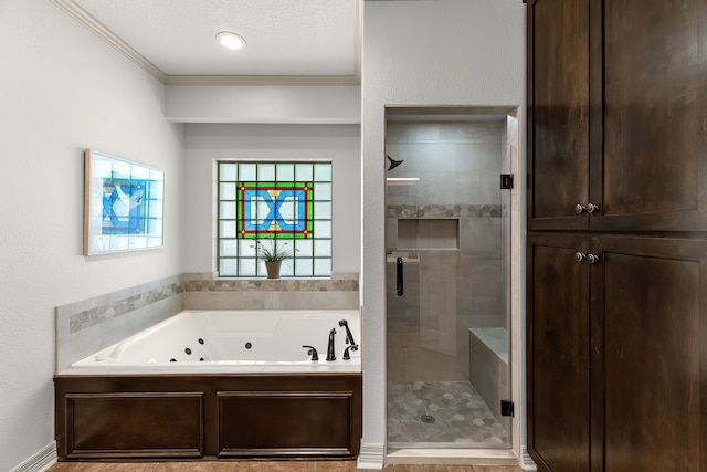 bathroom featuring separate shower and tub, a textured ceiling, and ornamental molding