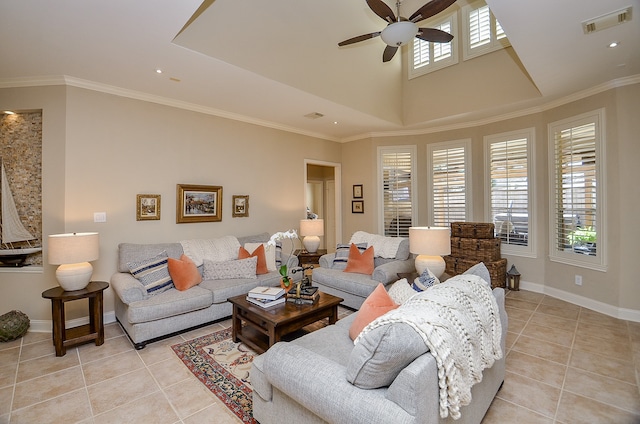 living room with light tile patterned floors, ceiling fan, and ornamental molding