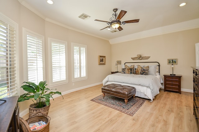 bedroom with light hardwood / wood-style flooring, ceiling fan, and crown molding