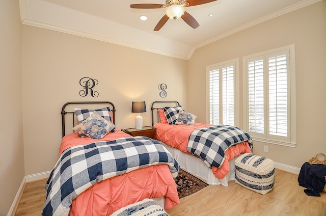 bedroom featuring ceiling fan, ornamental molding, and hardwood / wood-style flooring