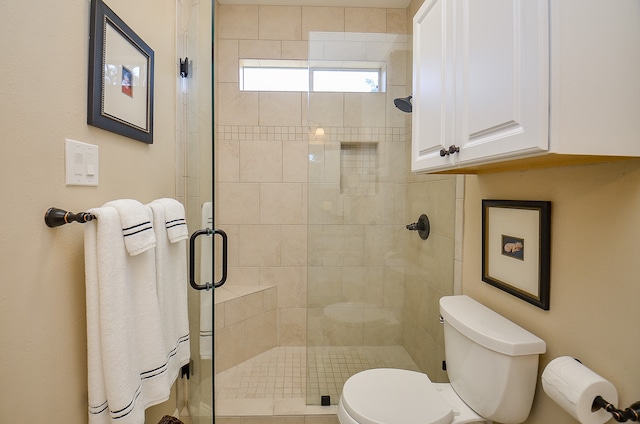 bathroom with radiator, toilet, and a shower with door